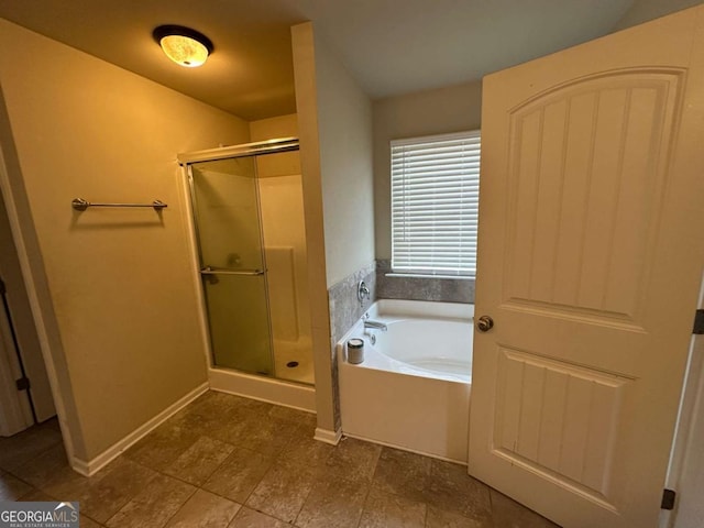 79 Parkmont Ln, Dallas, GA 30132 - bathroom featuring a shower stall, a garden tub, and tile patterned flooring