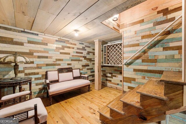 wine room with wooden walls and wood finished floors