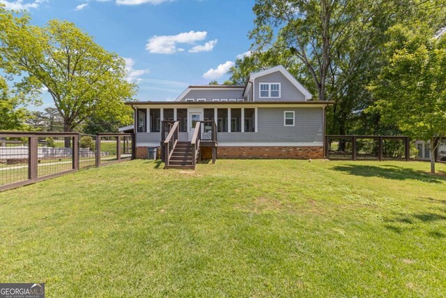 back of property featuring a sunroom