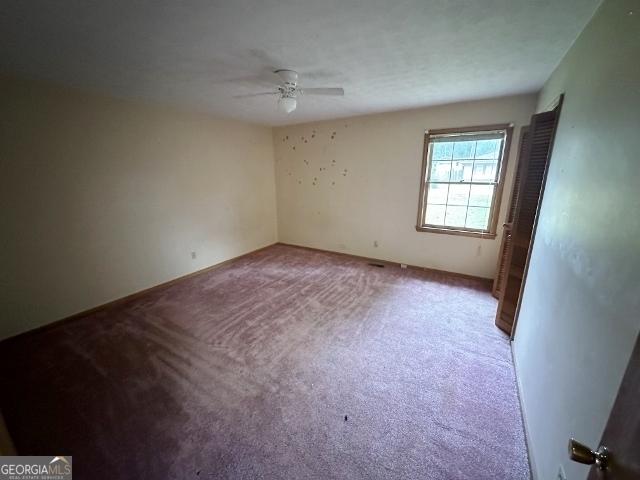 310 Advantage Ln, Swainsboro, GA 30401 - unfurnished room featuring ceiling fan and light colored carpet