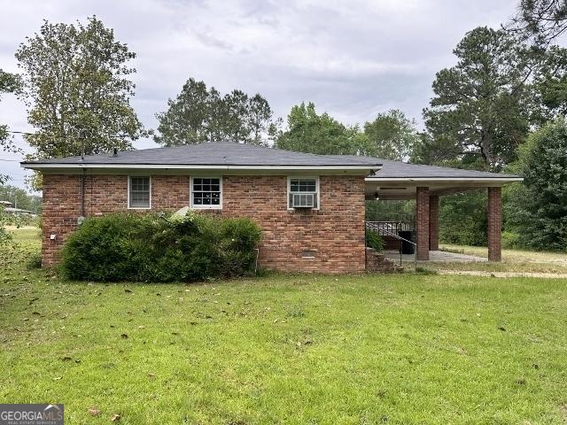 310 Advantage Ln, Swainsboro, GA 30401 - rear view of house with a lawn, crawl space, and brick siding