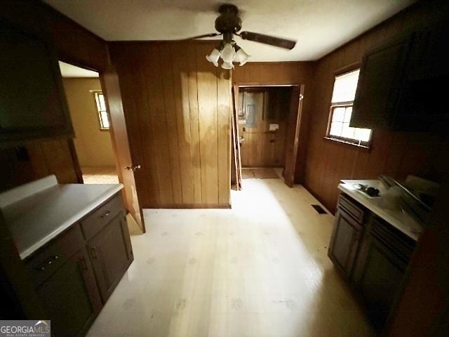 310 Advantage Ln, Swainsboro, GA 30401 - dining space with a ceiling fan, wooden walls, and light wood finished floors