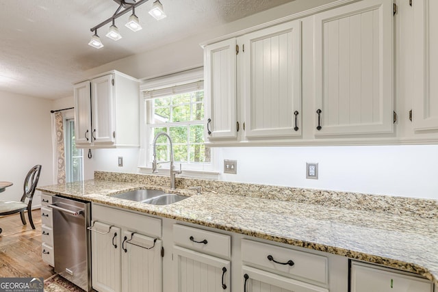 4314 Arbor Bridge Ct, Marietta, GA 30066 - kitchen featuring dishwasher, light wood-type flooring, a textured ceiling, white cabinets, and light stone counters