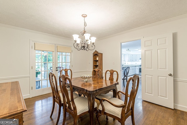 4314 Arbor Bridge Ct, Marietta, GA 30066 - dining room featuring a chandelier, crown molding, wood finished floors, a textured ceiling, and french doors
