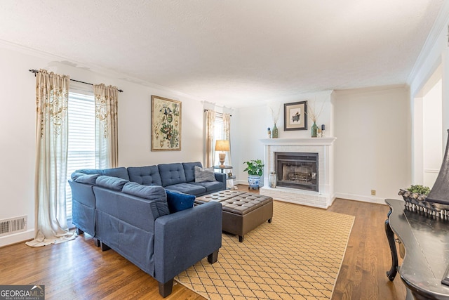 4314 Arbor Bridge Ct, Marietta, GA 30066 - living room with wood finished floors, ornamental molding, a brick fireplace, and healthy amount of natural light
