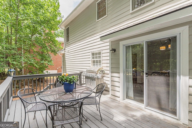 4314 Arbor Bridge Ct, Marietta, GA 30066 - wooden deck with outdoor dining area and a grill