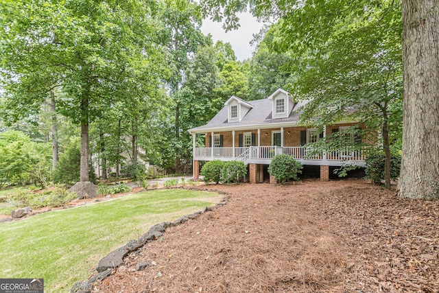 4314 Arbor Bridge Ct, Marietta, GA 30066 - cape cod house with brick siding, covered porch, a front yard, and roof with shingles