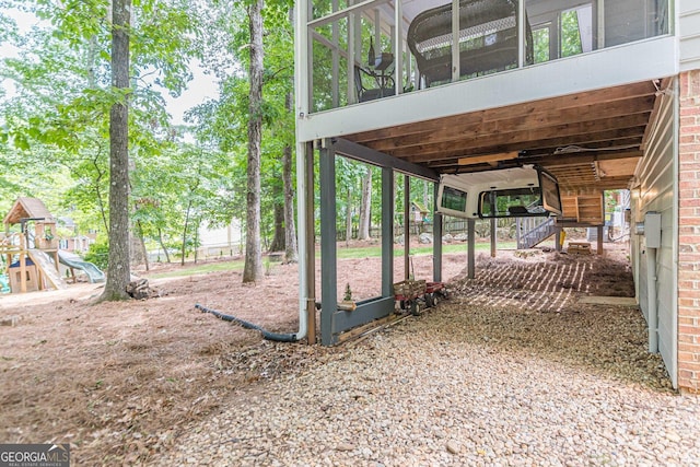 4314 Arbor Bridge Ct, Marietta, GA 30066 - view of yard with a sunroom, stairs, and a playground