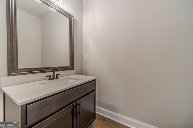 1482 Alcovy Station Rd, Covington, GA 30014 - bathroom featuring baseboards, wood finished floors, and vanity