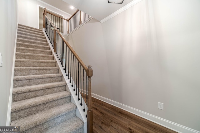 1482 Alcovy Station Rd, Covington, GA 30014 - stairway featuring wood finished floors, crown molding, and baseboards