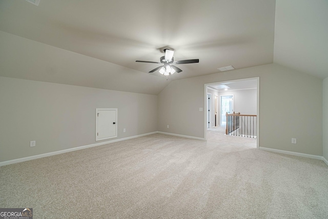 1482 Alcovy Station Rd, Covington, GA 30014 - additional living space featuring light carpet, vaulted ceiling, ceiling fan, and baseboards