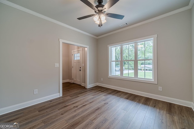 1482 Alcovy Station Rd, Covington, GA 30014 - spare room with baseboards, dark wood-style floors, ornamental molding, and ceiling fan