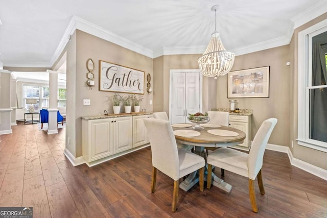 3232 Cates Ave NE, Brookhaven, GA 30319 - dining space featuring dark wood finished floors, a chandelier, ornamental molding, and decorative columns