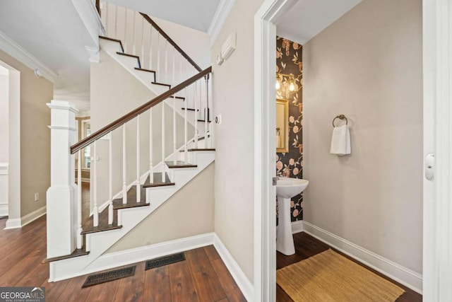3232 Cates Ave NE, Brookhaven, GA 30319 - stairs with wood finished floors and crown molding