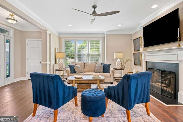 3232 Cates Ave NE, Brookhaven, GA 30319 - living room with wood finished floors, ceiling fan, a fireplace, crown molding, and recessed lighting
