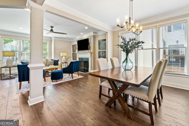 3232 Cates Ave NE, Brookhaven, GA 30319 - dining room with decorative columns, dark wood-style floors, a fireplace, ornamental molding, and ceiling fan