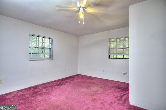 empty room featuring carpet floors and ceiling fan