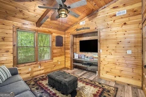 162 Little Falls Dr, Mineral Bluff, GA 30559 - living area featuring wood walls, wood ceiling, wood finished floors, and a ceiling fan