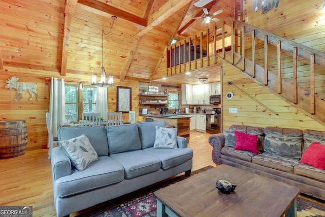 162 Little Falls Dr, Mineral Bluff, GA 30559 - living area featuring wood walls, wood ceiling, light wood-style flooring, healthy amount of natural light, and beamed ceiling