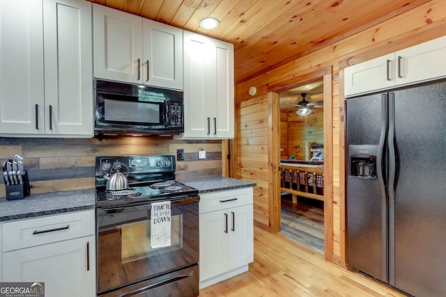 162 Little Falls Dr, Mineral Bluff, GA 30559 - kitchen with black appliances, dark countertops, wooden ceiling, white cabinets, and light wood finished floors
