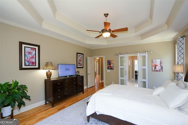 3740 Duckcove Way, Cumming, GA 30041 - bedroom featuring a tray ceiling, ornamental molding, wood finished floors, and ceiling fan