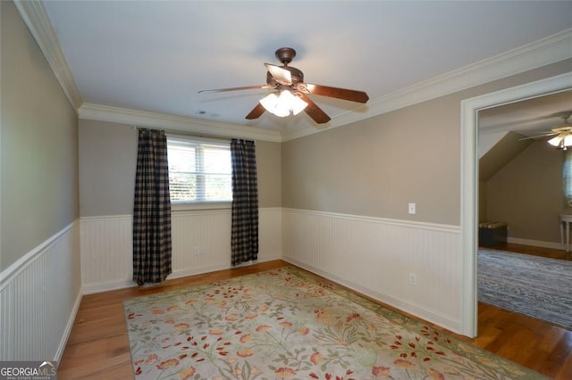 3740 Duckcove Way, Cumming, GA 30041 - spare room with a ceiling fan, wood finished floors, wainscoting, and crown molding