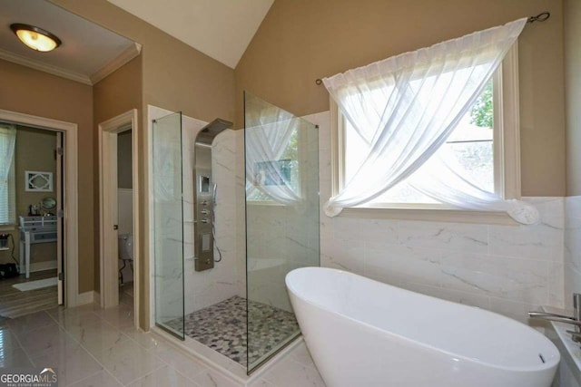 bathroom with a marble finish shower, a freestanding tub, ornamental molding, marble finish floors, and toilet