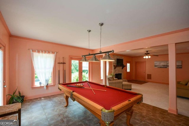 game room featuring a fireplace, baseboards, billiards, ornamental molding, and a ceiling fan