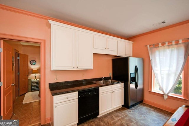 kitchen featuring black dishwasher, a sink, refrigerator with ice dispenser, dark countertops, and crown molding