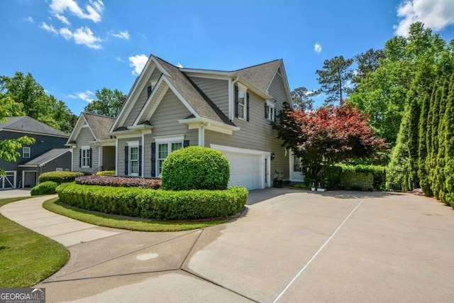 view of home's exterior with a garage and concrete driveway