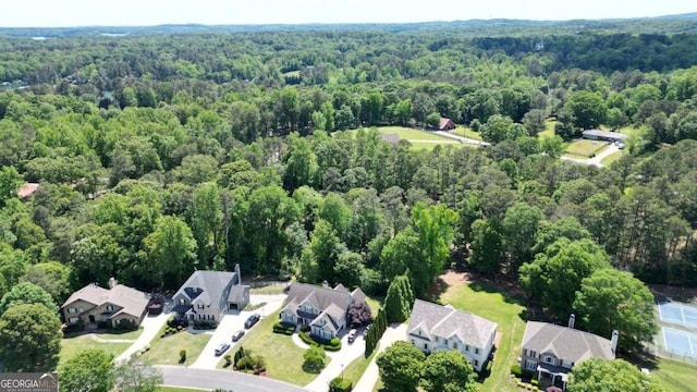 aerial view of residential area with a forest