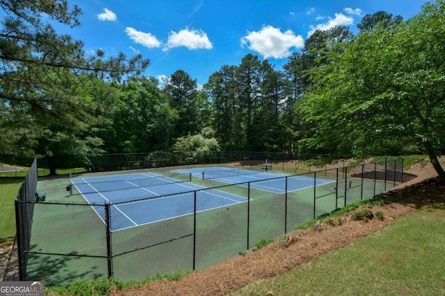 view of tennis court with fence