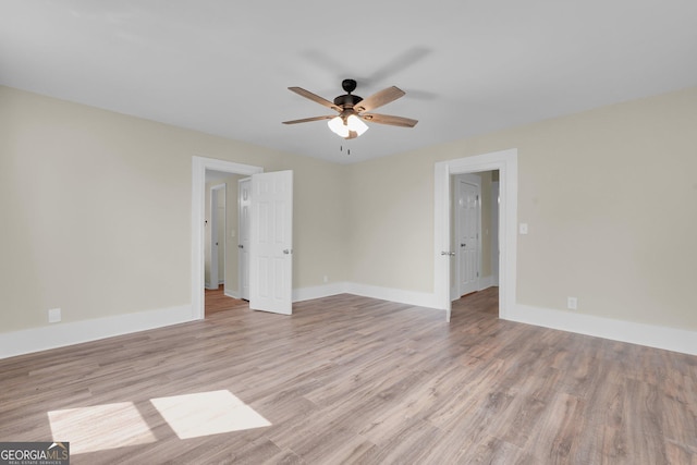 245 N Terrell St, Metter, GA 30439 - empty room featuring ceiling fan, light wood finished floors, and baseboards
