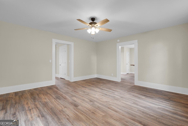 245 N Terrell St, Metter, GA 30439 - spare room with ceiling fan, baseboards, and wood finished floors