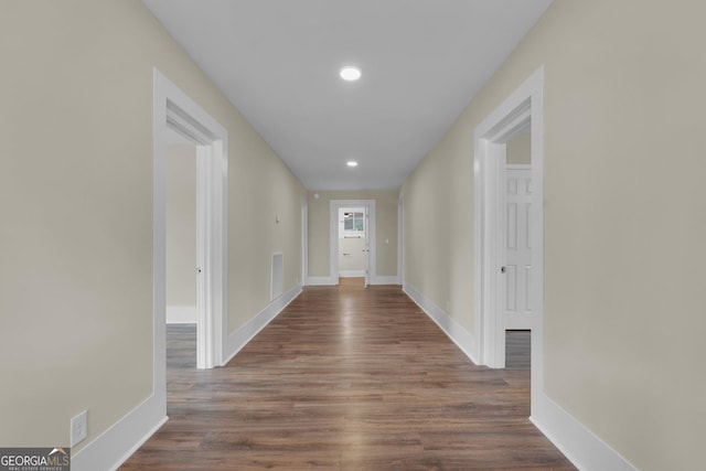 245 N Terrell St, Metter, GA 30439 - hall with baseboards, dark wood-style floors, and recessed lighting