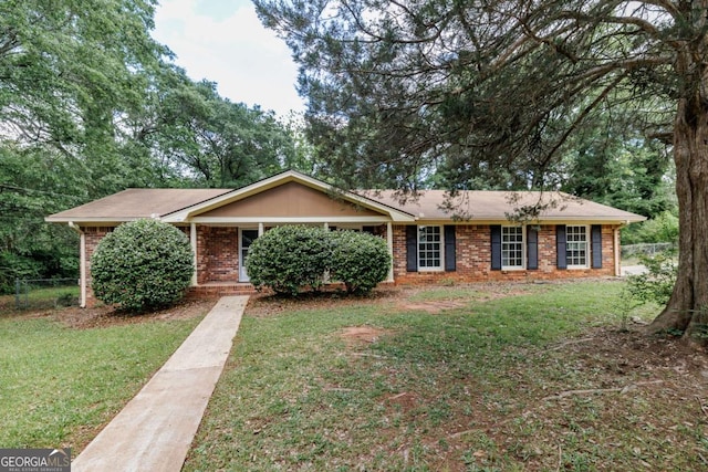ranch-style house featuring brick siding