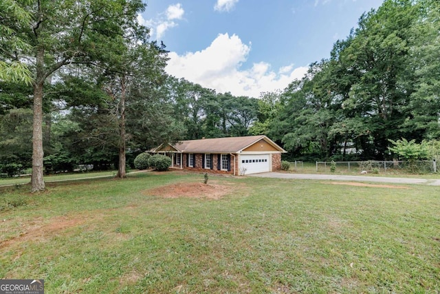 view of front of home featuring an attached garage, driveway, and brick siding