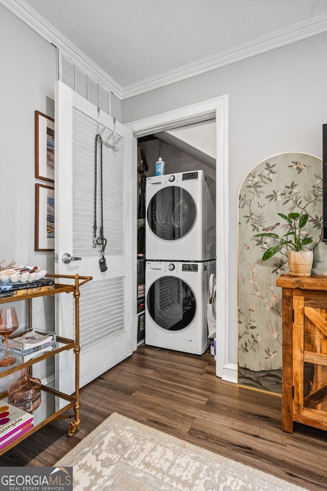 120 Biscayne Dr NW Unit C13, Atlanta, GA 30309 - laundry area with stacked washing machine and dryer, wood finished floors, and crown molding