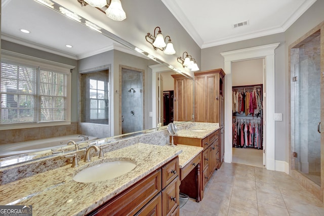 bathroom with a stall shower, vanity, a spacious closet, tile patterned floors, and ornamental molding