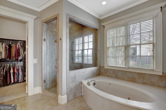 bathroom with a stall shower, plenty of natural light, a tub with jets, a spacious closet, and crown molding