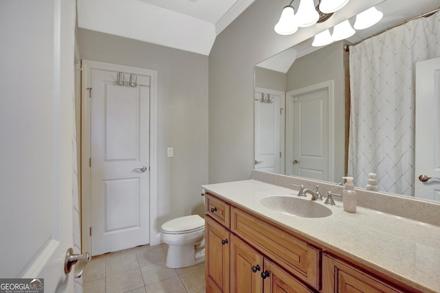 bathroom featuring tile patterned flooring, vanity, and toilet