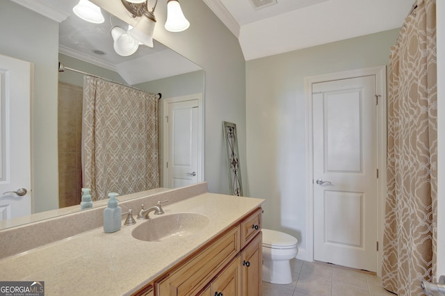 bathroom featuring tile patterned floors, toilet, vanity, and ornamental molding
