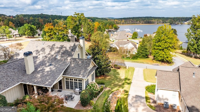 aerial perspective of suburban area with a nearby body of water