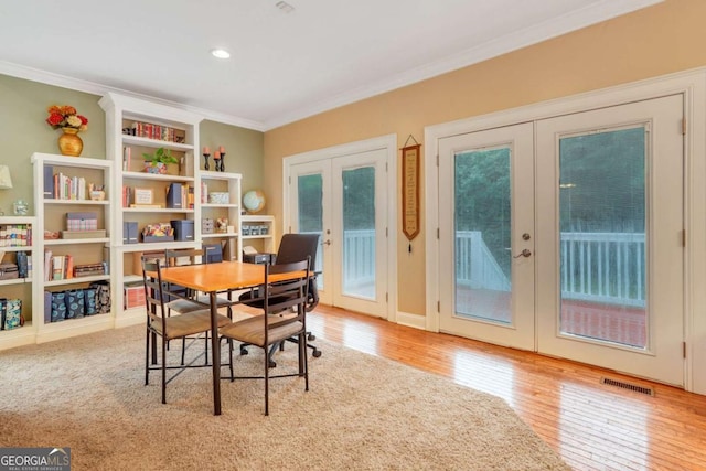 dining room featuring french doors, crown molding, wood finished floors, a desk, and recessed lighting