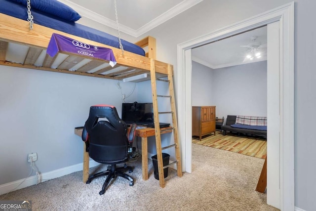 bedroom featuring carpet flooring, ornamental molding, baseboards, and a desk