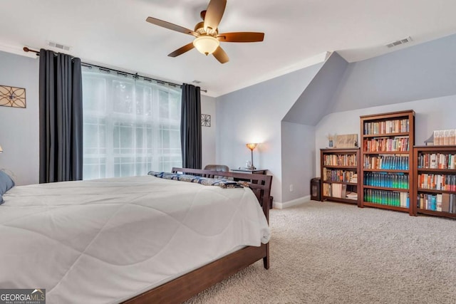 bedroom featuring carpet flooring, vaulted ceiling, baseboards, and a ceiling fan
