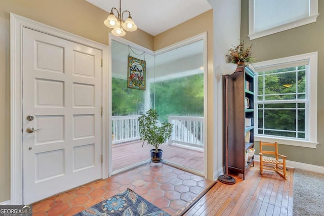 doorway featuring baseboards