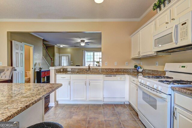 10900 Wittenridge Dr Unit L6, Alpharetta, GA 30022 - kitchen with white appliances, a sink, white cabinetry, ornamental molding, and a ceiling fan