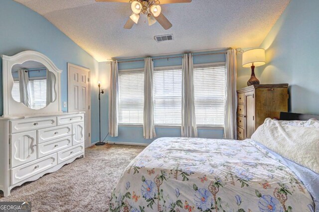 10900 Wittenridge Dr Unit L6, Alpharetta, GA 30022 - bedroom featuring vaulted ceiling, light carpet, a textured ceiling, a ceiling fan, and baseboards