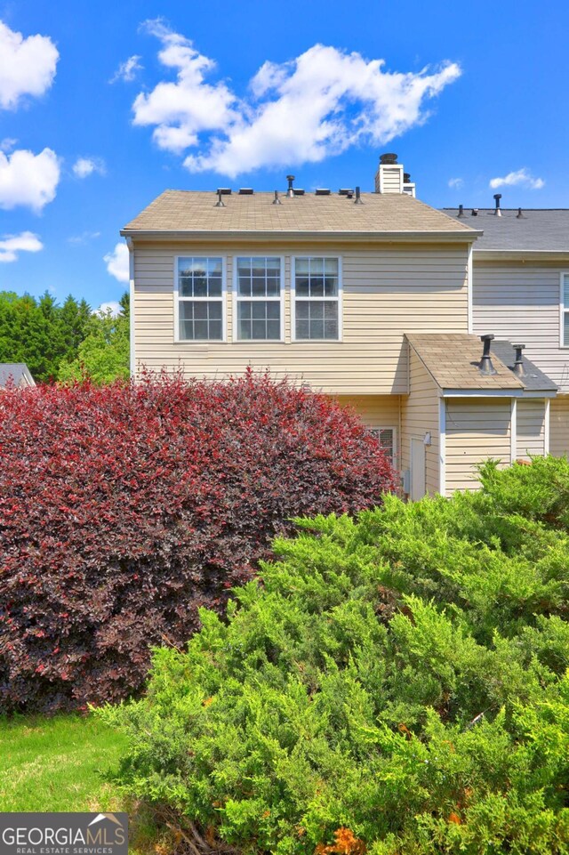 10900 Wittenridge Dr Unit L6, Alpharetta, GA 30022 - view of home's exterior featuring a chimney